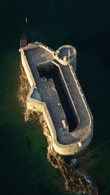 Aerial view of the Château du Taureau stands as a sentinel its stone walls a stark contrast to the deep blue sea Plouezoc h Bretagne France. Aerial view of the Château du Taureau stands as a sentinel its stone walls a stark contrast to the deep blue sea Plouezoc h Bretagne France.