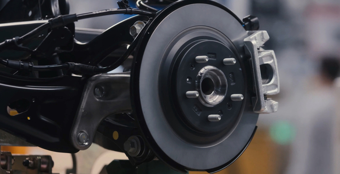 View of a car brake disc assembly on an automotive production line in a factory setting in Jilin China. View of a car brake disc assembly on an automotive production line in a factory setting in Jilin China.