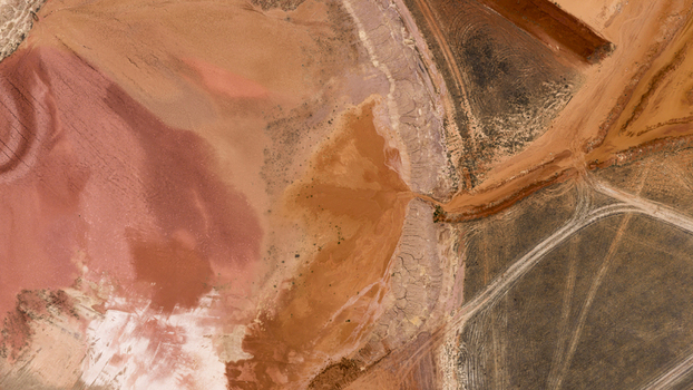 Aerial view of industrial salt lake patterns with vibrant pink brown and yellow mineral deposits and sand textures in Kalbarri Western Australia Australia. Aerial view of industrial salt lake patterns with vibrant pink brown and yellow mineral deposits and sand textures in Kalbarri Western Australia Australia.