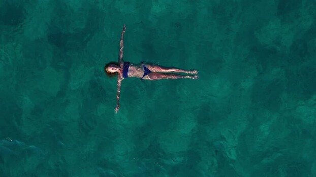 Aerial view of women swimming off Losinj island Croatia.