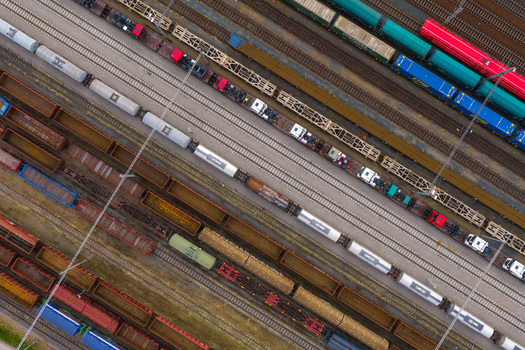 Aerial view of freight trains parked on parallel railway tracks at a large marshalling yard in Breclav South Moravian Region Czechia.