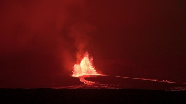 View of a fiery volcanic eruption at night United States.