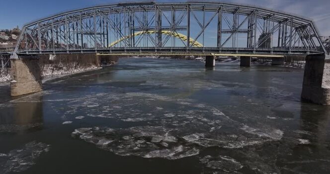 Aerial view of the Ohio River with ice and bridges in Cincinnati United States. Aerial view of the Ohio River with ice and bridges in Cincinnati United States.