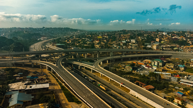 Aerial view of the Pokuase Interchange featuring multi level highway ramps and surrounding urban residential areas in Ga North Municipal Greater Accra Region Ghana. Aerial view of the Pokuase Interchange featuring multi level highway ramps and surrounding urban residential areas in Ga North Municipal Greater Accra Region Ghana.