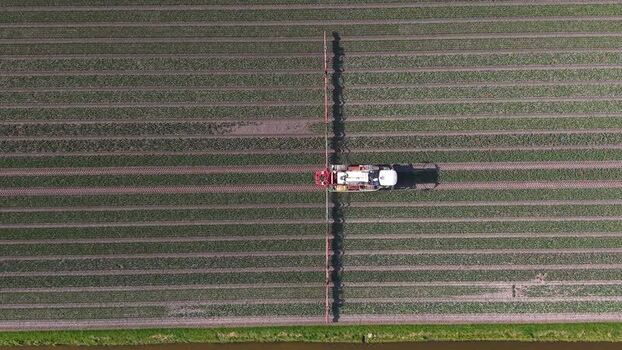 Aerial view of tractor in field Opmeer North Holland Netherlands. Aerial view of tractor in field Opmeer North Holland Netherlands.