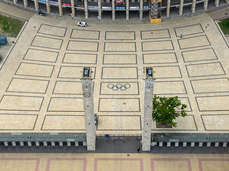 Berlin Germany 26 September 2026 Aerial view of Olympiastadion Berlin showing the iconic Olympic rings on the paved plaza stone towers and surrounding stadium architecture.
