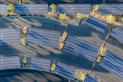 Aerial view of solar panel carports providing shade in a parking lot with small trees and asphalt lanes in Las Vegas Nevada United States. Aerial view of solar panel carports providing shade in a parking lot with small trees and asphalt lanes in Las Vegas Nevada United States.