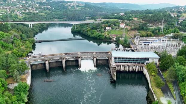 Aerial view of Velle Dam and electric substation on Minho River Spain. Aerial view of Velle Dam and electric substation on Minho River Spain.
