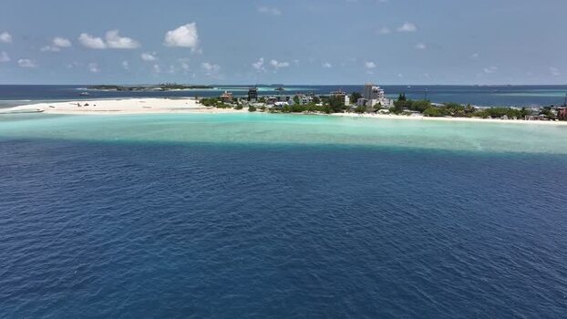 Aerial view of a tropical island with turquoise waters Maldives. Aerial view of a tropical island with turquoise waters Maldives.