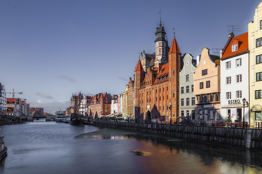 Gdansk Poland 06 September 2026 View of the historic Motlawa River waterfront with colorful merchant houses traditional brick architecture and calm water under a clear blue sky. Gdansk Poland 06 September 2026 View of the historic Motlawa River waterfront with colorful merchant houses traditional brick architecture and calm water under a clear blue sky.
