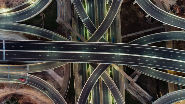 Aerial view of the multi level Pokuase Interchange featuring complex curved ramps asphalt roads and lane markings in Ga North Municipal Greater Accra Region Ghana. Aerial view of the multi level Pokuase Interchange featuring complex curved ramps asphalt roads and lane markings in Ga North Municipal Greater Accra Region Ghana.