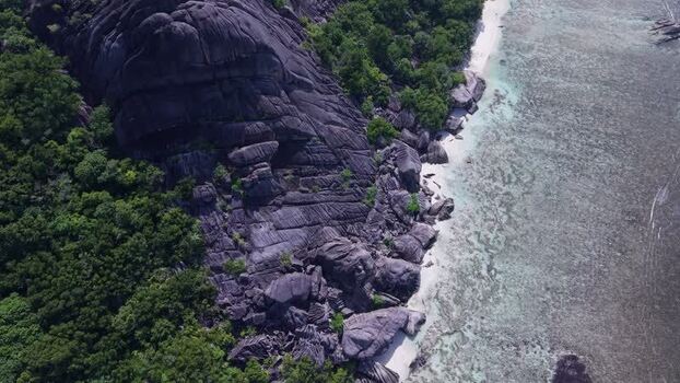 Aerial view of Anse Reunion granite boulders Seychelles.