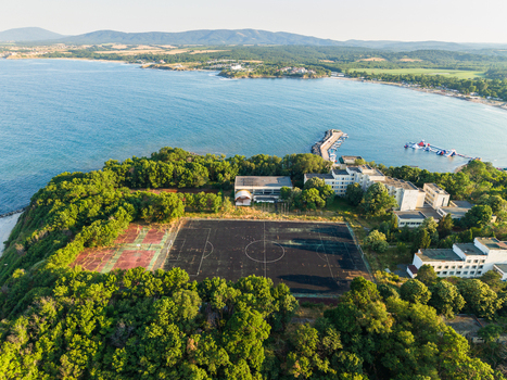 Aerial view of a sports field and surrounding buildings on a cliff overlooking the Black Sea in Kiten Burgas Bulgaria. Aerial view of a sports field and surrounding buildings on a cliff overlooking the Black Sea in Kiten Burgas Bulgaria.