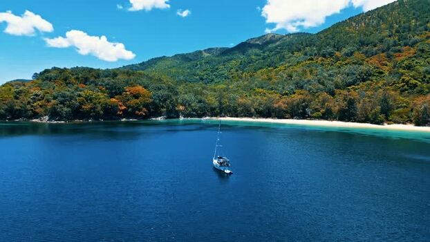 Aerial view of a sailboat in a tropical bay Honduras. Aerial view of a sailboat in a tropical bay Honduras.