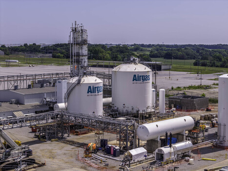Aerial view of the Airgas industrial gas facility featuring large white storage tanks complex piping infrastructure and construction equipment in Clarksville Tennessee United States.