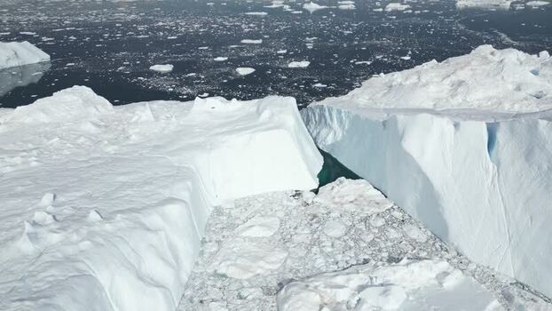 Aerial view of massive icebergs in Ilulissat Icefjord Greenland. Aerial view of massive icebergs in Ilulissat Icefjord Greenland.