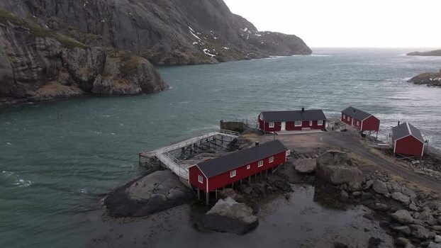 Aerial view of red fishing cabins in Lofoten Norway.