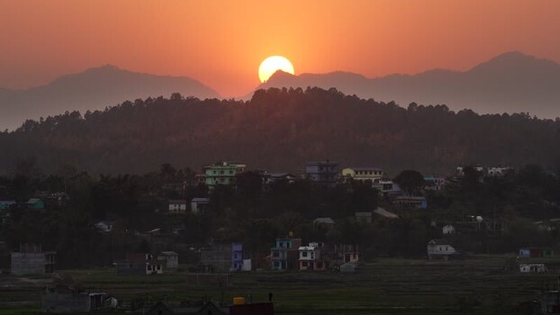 View of sunset over mountains and village Nepal.