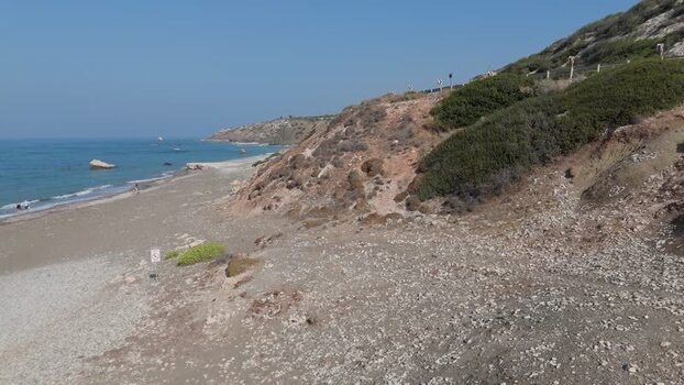 Aerial view of coastal cliffs and sandy beach Cyprus.