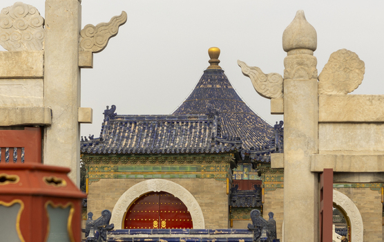 View of the Imperial Vault of Heaven with its iconic blue tiled roof and intricate stone carvings at the Temple of Heaven complex in Beijing Beijing China. View of the Imperial Vault of Heaven with its iconic blue tiled roof and intricate stone carvings at the Temple of Heaven complex in Beijing Beijing China.
