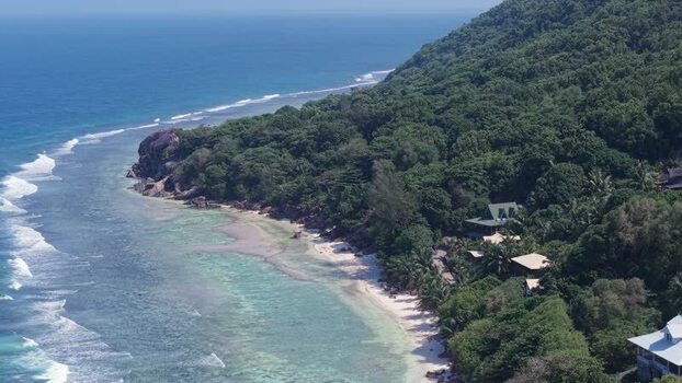 Aerial view of Anse Reunion coastline and turquoise waters Seychelles.