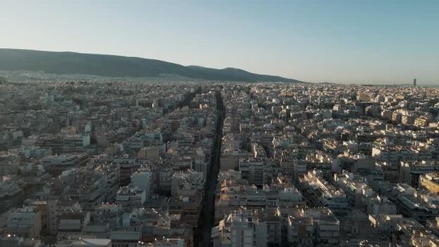 Aerial view of the dense urban skyline and hills in Athens Greece.