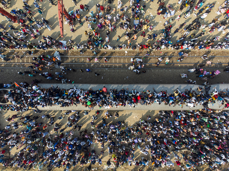 Tongi Bangladesh 04 February 2024 Aerial view of Tongi Junction with a train packed with people on the roof and crowded platforms during the Biswa Ijtema festival. Tongi Bangladesh 04 February 2024 Aerial view of Tongi Junction with a train packed with people on the roof and crowded platforms during the Biswa Ijtema festival.
