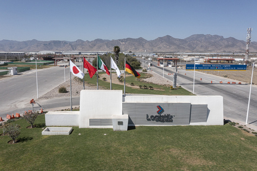 San Luis Potosi Mexico 24 February 2026 Aerial view of the entrance to Parque Industrial Logistik featuring international flags modern signage paved roads and mountains. San Luis Potosi Mexico 24 February 2026 Aerial view of the entrance to Parque Industrial Logistik featuring international flags modern signage paved roads and mountains.