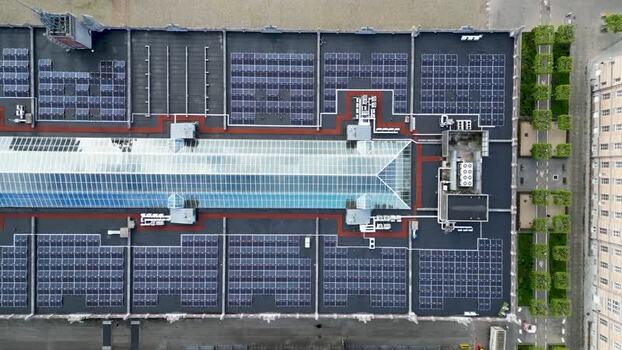 Aerial view of solar panels on a building roof Belgium.