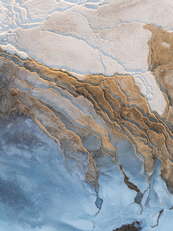 Aerial view of the volcanic landscape of Reykjanes with intricate lava textures and mineral deposits in Grindavikurbaer Iceland. Aerial view of the volcanic landscape of Reykjanes with intricate lava textures and mineral deposits in Grindavikurbaer Iceland.