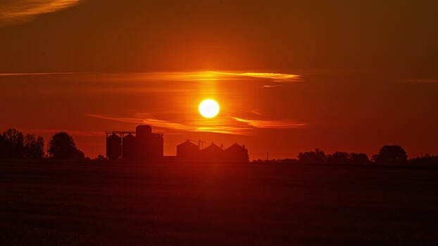 View of grain silos at sunset in Latvia.