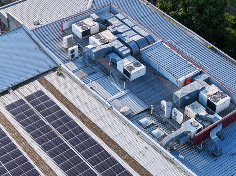 Melbourne Australia 22 September 2026 Aerial view of industrial factory rooftops in Kilsyth featuring solar panels and HVAC ventilation systems. Melbourne Australia 22 September 2026 Aerial view of industrial factory rooftops in Kilsyth featuring solar panels and HVAC ventilation systems.