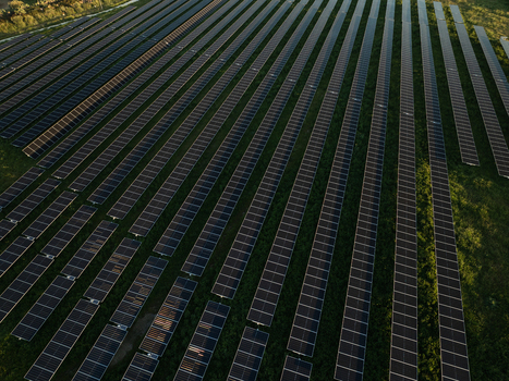 Aerial view of a large solar farm with rows of photovoltaic panels installed on green fields Augusta Sicily Italy. Aerial view of a large solar farm with rows of photovoltaic panels installed on green fields Augusta Sicily Italy.