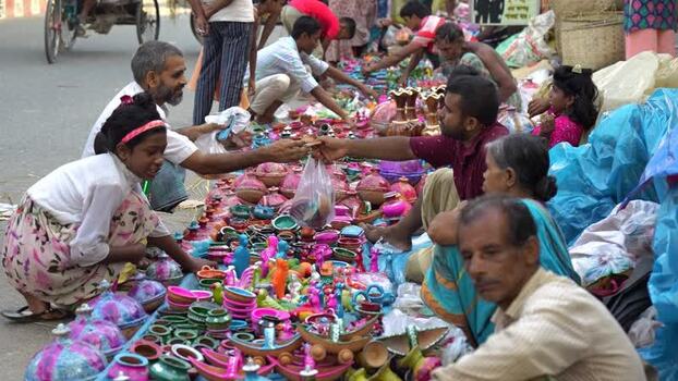 View of people at a colorful street market in Bogura Bangladesh. View of people at a colorful street market in Bogura Bangladesh.