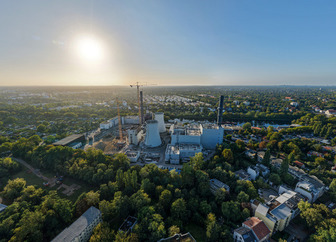 Aerial view of the deconstruction site of the Combined Heat and Power Plant Lichterfelde with industrial cranes and cooling towers amidst urban greenery in Berlin Berlin Germany. Aerial view of the deconstruction site of the Combined Heat and Power Plant Lichterfelde with industrial cranes and cooling towers amidst urban greenery in Berlin Berlin Germany.