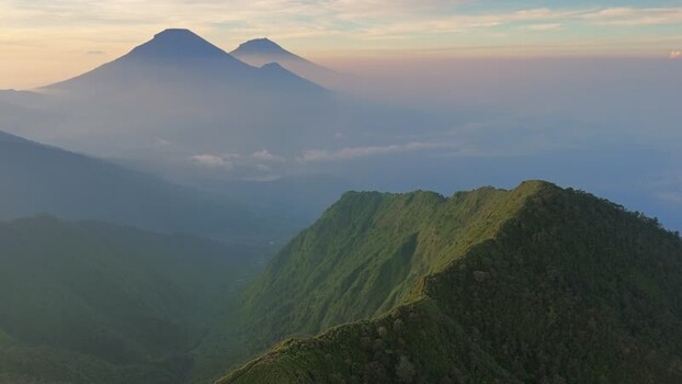 Aerial view of Dieng Plateau and volcanic peaks Indonesia.
