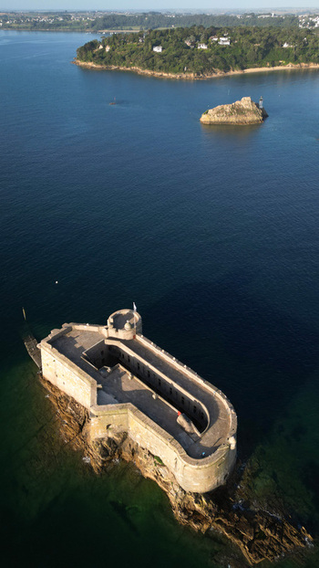Aerial view of Château du Taureau stands defiant against the deep blue sea a stone fortress amidst the waves Plouezoc h Bretagne France. Aerial view of Château du Taureau stands defiant against the deep blue sea a stone fortress amidst the waves Plouezoc h Bretagne France.
