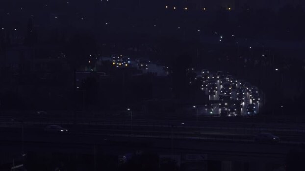 Aerial view of highway traffic at night in Algeria.