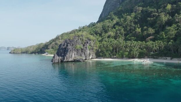 Aerial view of Papaya Beach and limestone cliffs in Philippines. Aerial view of Papaya Beach and limestone cliffs in Philippines.