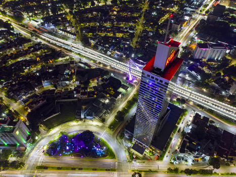Aerial view of the illuminated Riu Plaza Guadalajara hotel and Glorieta Stampede roundabout at night with vibrant city lights and traffic light trails in Guadalajara Jalisco Mexico. Aerial view of the illuminated Riu Plaza Guadalajara hotel and Glorieta Stampede roundabout at night with vibrant city lights and traffic light trails in Guadalajara Jalisco Mexico.