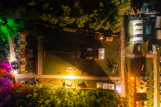 Herzogenaurach Germany 25 July 2025 Aerial view of the Open Beatz Festival grounds at night with illuminated stages tents and surrounding trees. Herzogenaurach Germany 25 July 2025 Aerial view of the Open Beatz Festival grounds at night with illuminated stages tents and surrounding trees.