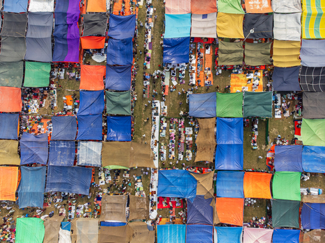 Tongi Bangladesh 31 January 2025 Aerial view of the Bishwa Ijtema gathering with thousands of people under colorful tarps and makeshift tents. Tongi Bangladesh 31 January 2025 Aerial view of the Bishwa Ijtema gathering with thousands of people under colorful tarps and makeshift tents.