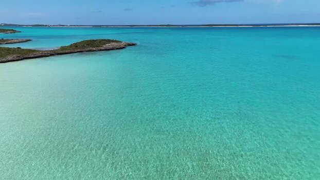 Aerial view of Crab Cay and turquoise waters The Bahamas.