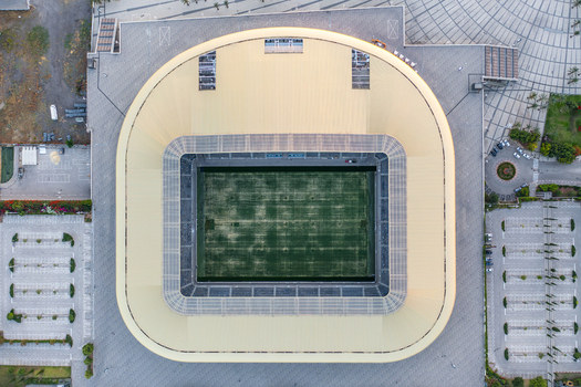 Aerial view of Sammy Ofer Stadium featuring the central football pitch and surrounding paved parking areas in Haifa Haifa District Israel. Aerial view of Sammy Ofer Stadium featuring the central football pitch and surrounding paved parking areas in Haifa Haifa District Israel.
