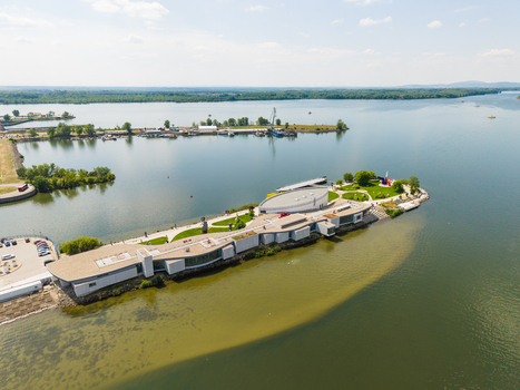 Aerial view of Danubiana Meulensteen Art Museum on a peninsula in the Danube River with modern architecture and outdoor sculptures Bratislava Bratislavsky kraj Slovakia. Aerial view of Danubiana Meulensteen Art Museum on a peninsula in the Danube River with modern architecture and outdoor sculptures Bratislava Bratislavsky kraj Slovakia.