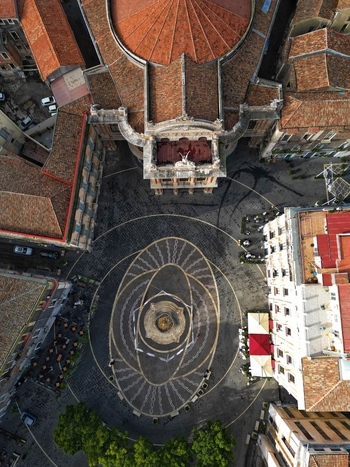 Aerial view of Teatro Massimo Bellini and the patterned pavement of the square with outdoor cafes and historic rooftops Catania Sicily Italy. Aerial view of Teatro Massimo Bellini and the patterned pavement of the square with outdoor cafes and historic rooftops Catania Sicily Italy.