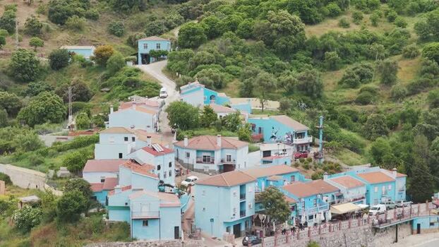 Aerial view of the blue houses of Juzcar Spain.