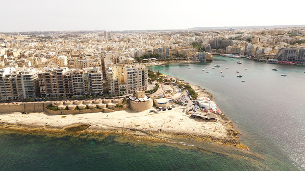 Aerial view of the urban coastline and historic fortifications at Tigne Point in Malta. Aerial view of the urban coastline and historic fortifications at Tigne Point in Malta.