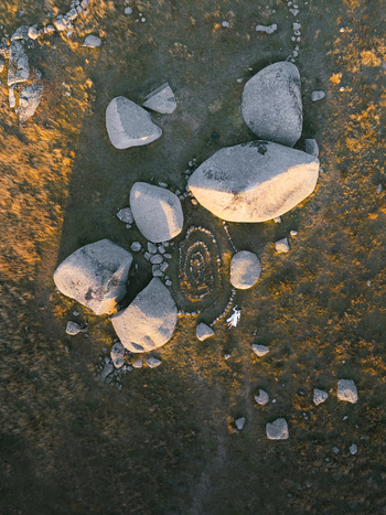Aerial view of ancient rocks and a labyrinthine stone circle the golden light accentuating the natural artistry Nasbinals Occitanie France. Aerial view of ancient rocks and a labyrinthine stone circle the golden light accentuating the natural artistry Nasbinals Occitanie France.