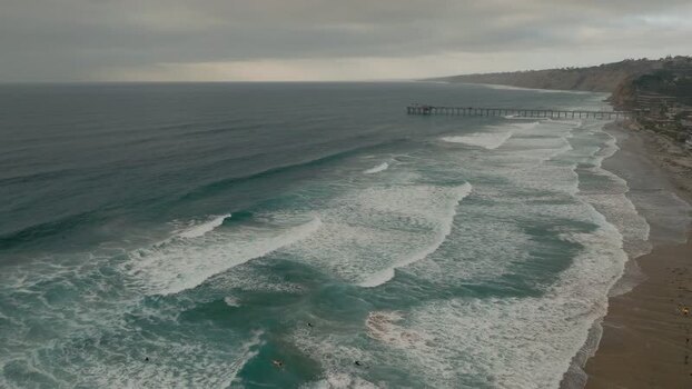Aerial view of waves crashing on the beach in La Jolla United States.